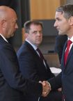 AfD parliamentary party leader Bjoern Hoecke, right, shakes hands with Thomas Kemmerich of the Free Democrats, in Erfurt, Germany, Wednesday, Feb. 5, 2020. Kemmerich, a pro-business politician, has been elected as the governor of the eastern German state of Thuringia in a surprise result after a far-right party threw its votes behind him. (Martin Schutt/dpa via AP)  ERF802